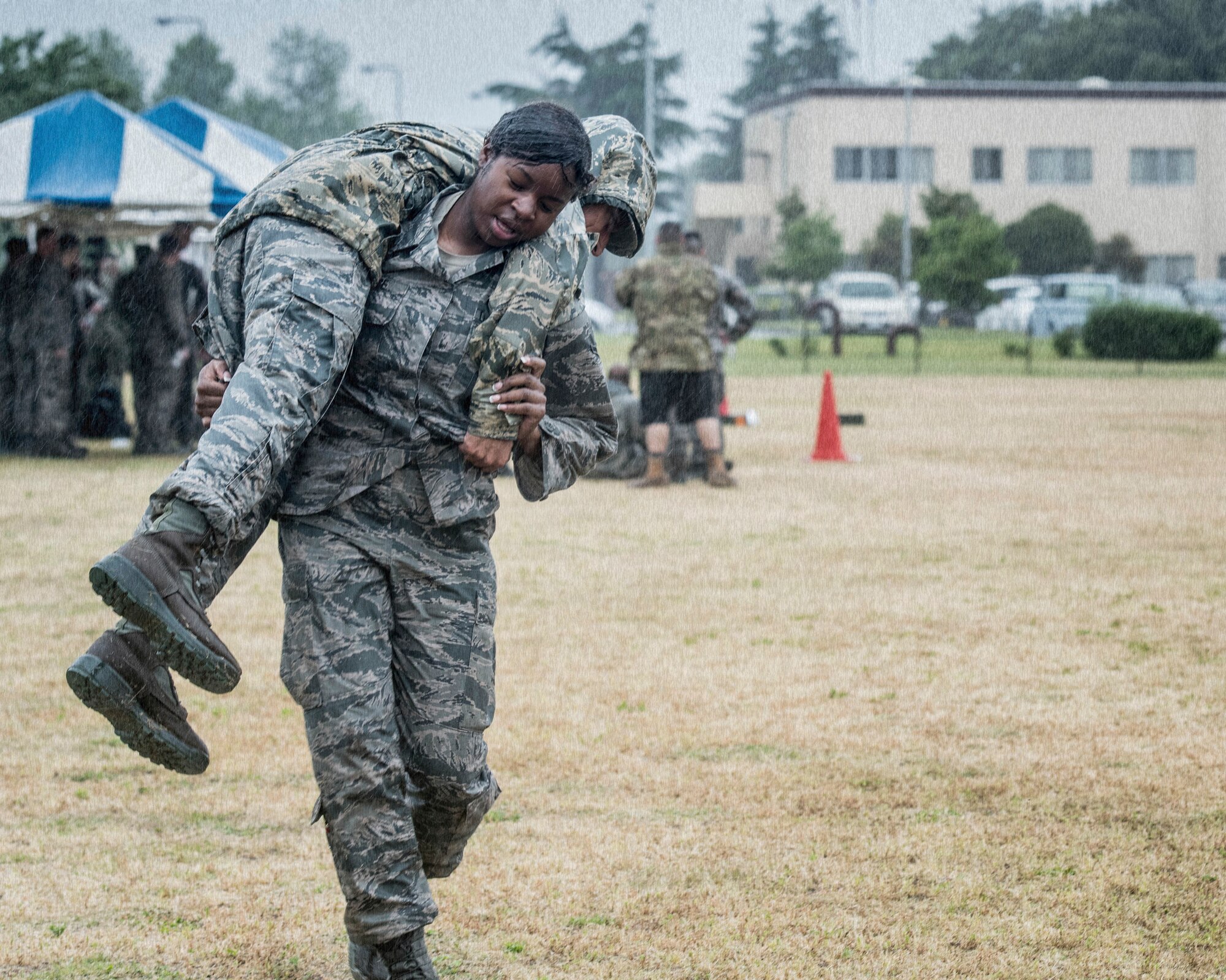 Airman Wanisha Spence, 374th Security Forces Squadron response force member, performs a fireman carry during Yokota’s 2019 National Police Week Defenders Challenge at Yokota Air Base, Japan, May 21, 2019.