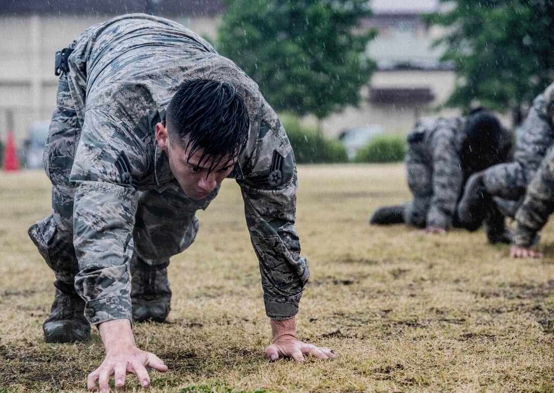 Senior Airman Shain Chairez, 374th Security Forces Squadron response force leader, performs a bear crawl during a Police Week Defenders Challenge at Yokota Air Base, Japan, May 21, 2019.