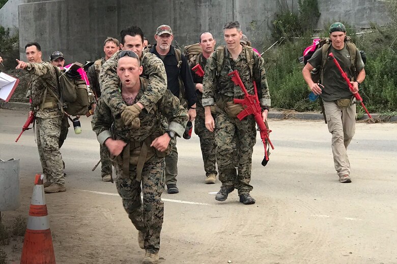 MCSC Marines carry double amputee during Recon Challenge