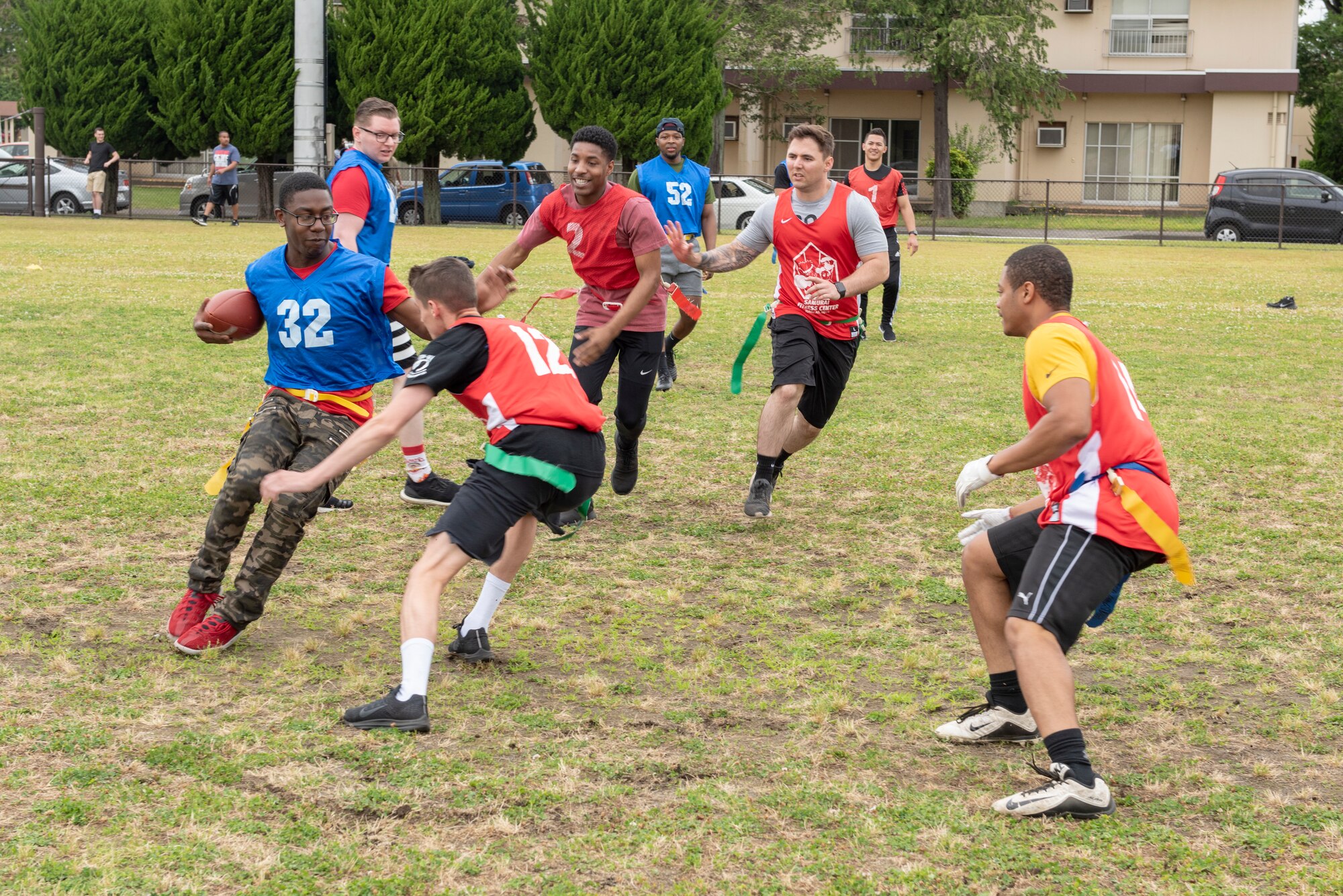 Airmen compete in a flag football tournament during Airman Appreciation Day at Yokota Air Base, Japan, May 31, 2019.