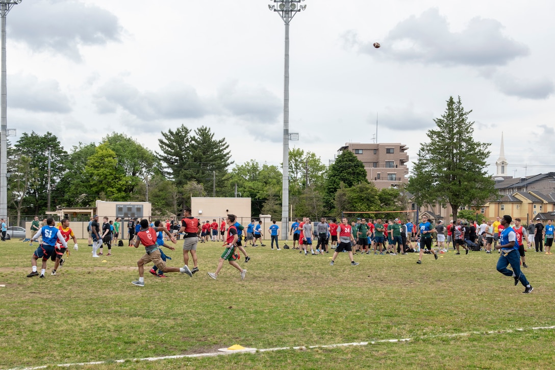Airmen compete in a flag football tournament during Airman Appreciation Day at Yokota Air Base, Japan, May 31, 2019