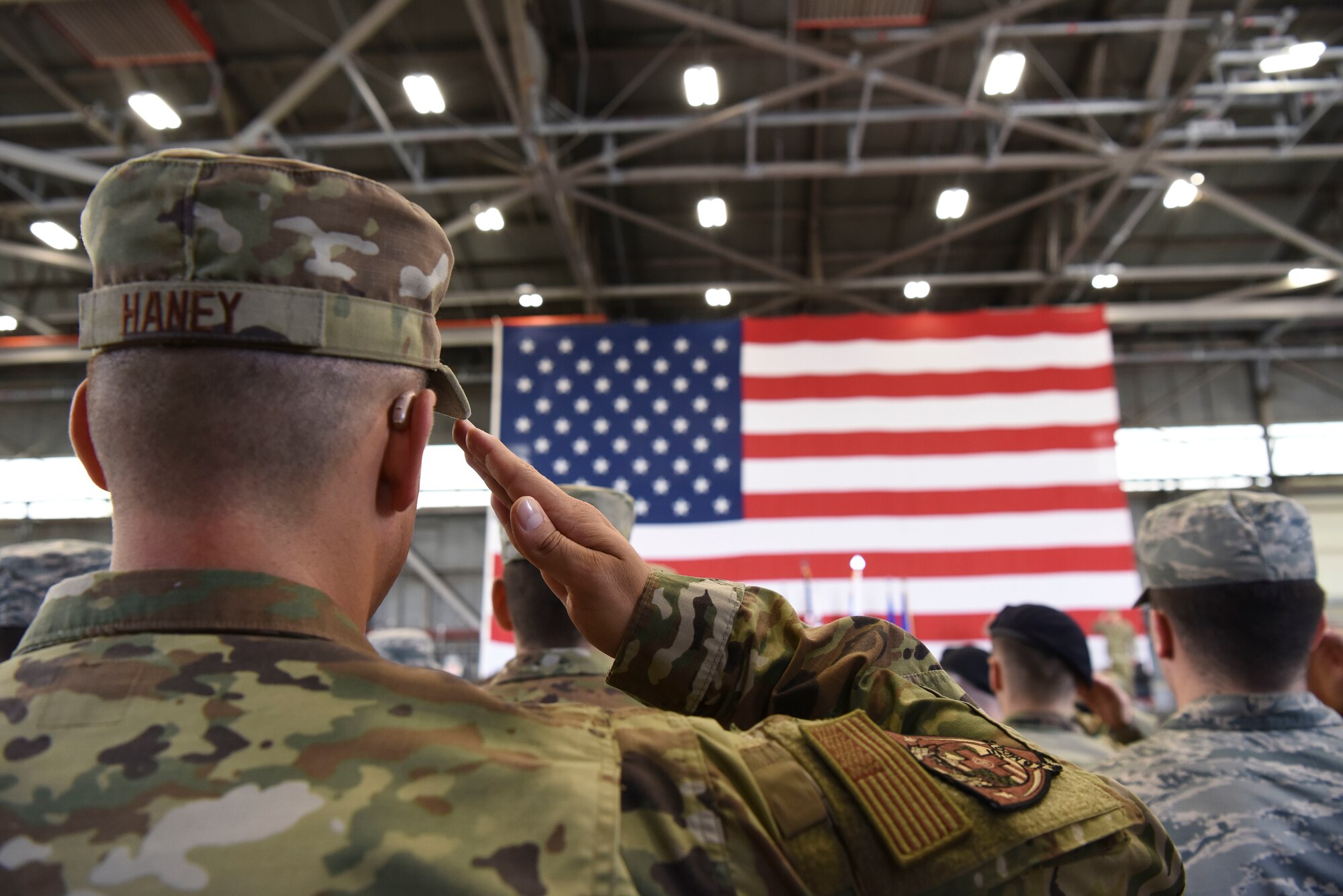 U.S. Air Force Master Sgt. Joshua Haney, 8th Medical Group flight medicine flight chief, renders a salute during a change of command ceremony at Kunsan Air Base, Republic of Korea, May 31, 2019. Col. Tad Clark, the new 8th Fighter Wing commander, is responsible for more than 2,700 active-duty personnel, four groups and 13 squadrons, including two F-16 fighter squadrons tasked with supporting Seventh Air Force operational readiness.  (U.S. Air Force photo by Senior Airman Savannah L. Waters)