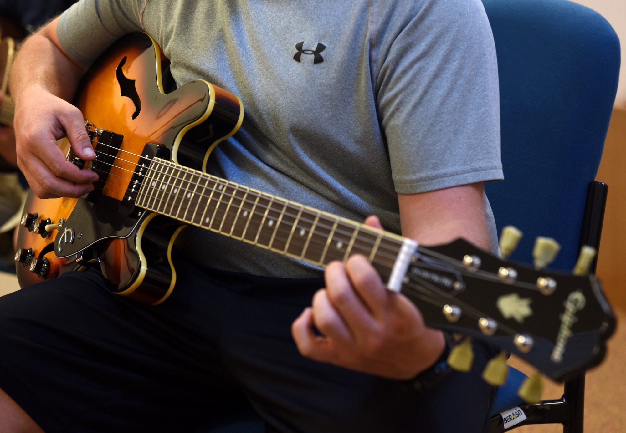 Tech. Sgt. David Eash, 39th Security Forces Squadron flight sergeant, plays a guitar during a guitar class held May 29, 2019, at Incirlik Air Base, Turkey. The base offers a variety of classes for Airmen interested in learning a new hobby such as guitar, cooking, painting and dance classes. (U.S. Air Force photo by Staff Sgt. Trevor Rhynes)