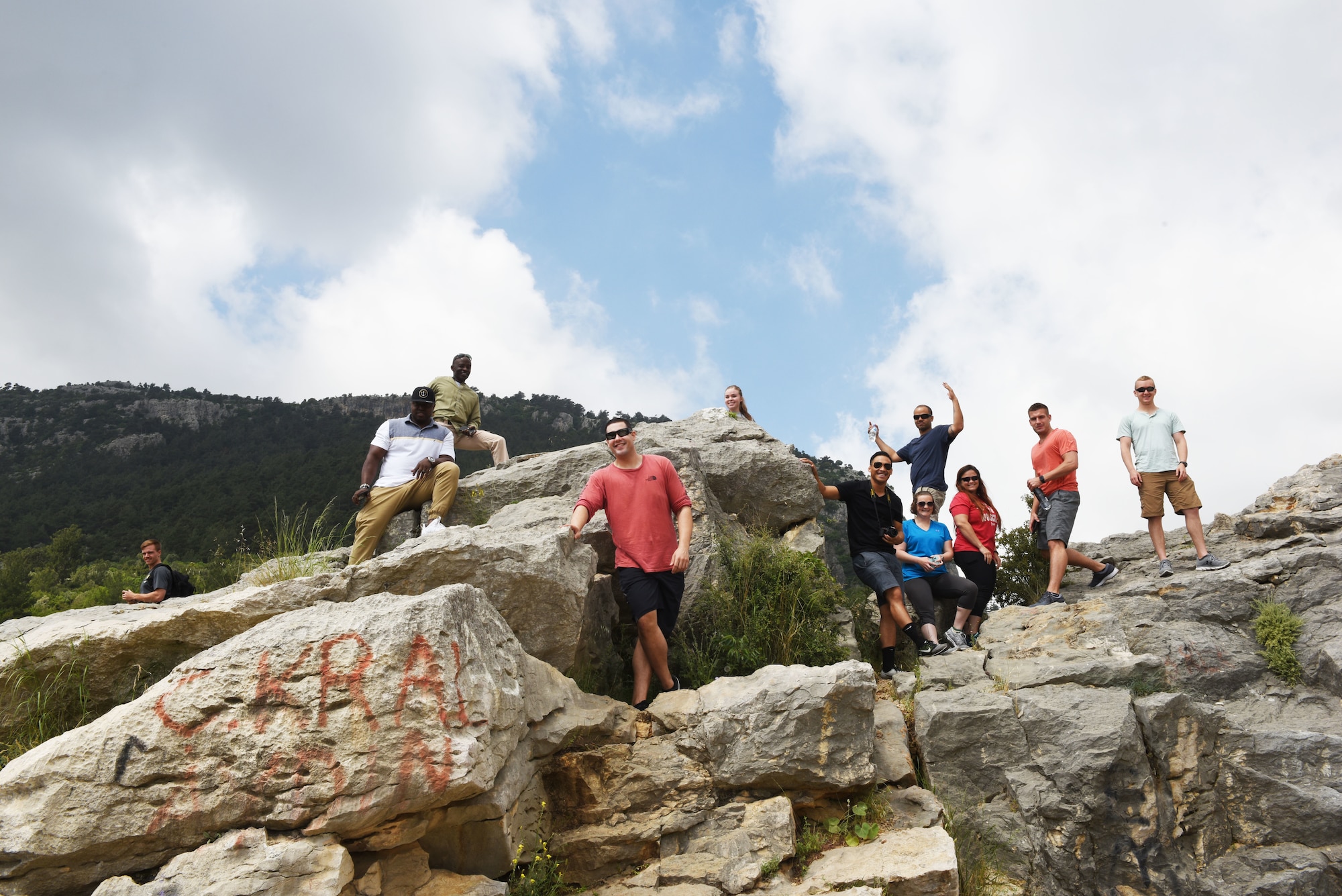 Airmen assigned to Incirlik Air Base climb on a rock formation next to the Varda Bridge during an outdoor recreation trip on May 25, 2019, in Adana, Turkey. This was one of several outdoor recreation trips the 39th Force Support Squadron organized for Airmen to enjoy the local area while learning about Turkish culture. (U.S. Air Force photo by Senior Airman Joshua Magbanua)