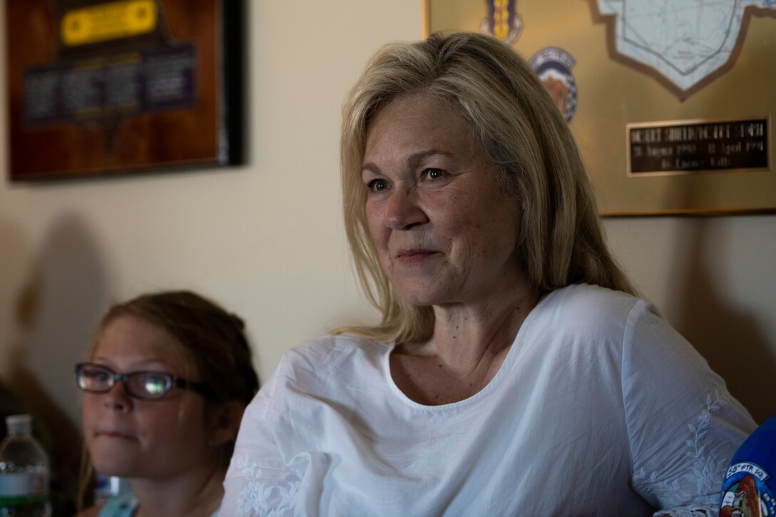 Tambrie McKinney, widow of retired U.S. Air Force Lt. Col. George "Buckshot" McKinney Jr., listens during a remembrance gathering for her husband at Eglin Air Force Base, Florida, on May 28, 2019.