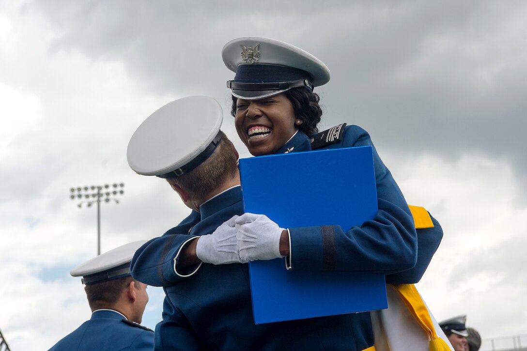 Air Force Academy graduates celebrate.