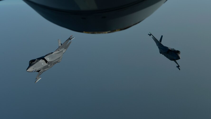 Two Air Force F-35A Lightning IIs break away from each other after an aerial refueling mission