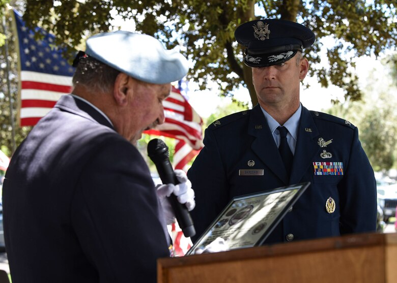 Mike Stadnick Jr., ceremony officiator, presents Col. Kris Barcomb, 30th Operation Group commander, with an appreciation certificate during a Memorial Day ceremony May 27 2019, at Santa Maria Cemetery, Calif. During Barcomb’s speech, he thanked veterans and service members for their service, the community for their support and fallen veterans for the ultimate sacrifice they made. (U.S. Air Force photo by Airman 1st Class Aubree Milks)