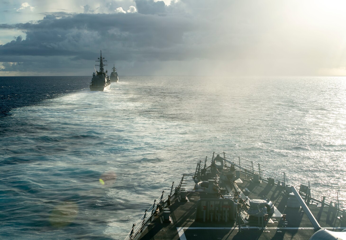 190529-N-CL550-0172 PHILIPPINE SEA (May 29, 2019) — The Arleigh Burke-class guided-missile destroyer USS Curtis Wilbur (DDG 54) steams in formation with Japanese Maritime Self Defense Force (JMSDF) destroyer JS Ariake (DD 109), left, and JMSDF destroyer JS Asahi. Curtis Wilbur is forward-deployed to the U.S. 7th Fleet area of operations in support of security and stability in the Indo-Pacific region.