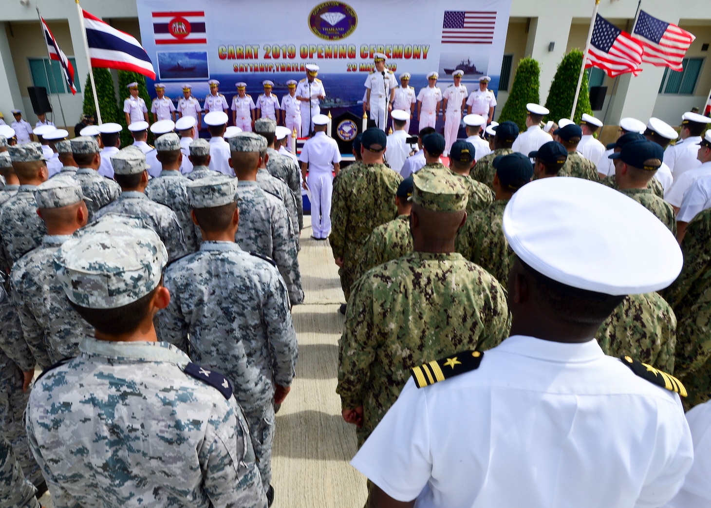 190529-N-UA460-0341 SATTAHIP NAVAL BASE, Thailand (May 29, 2019) - U.S. and Royal Thai Navy Sailors stand in formation together during the opening ceremony of Cooperation Afloat Readiness and Training (CARAT) Thailand 2019. This year marks the 25th iteration of CARAT, a multinational exercise series designed to enhance U.S. and partner navies' abilities to operate together in response to traditional and non-traditional maritime security challenges in the Indo-Pacific region.