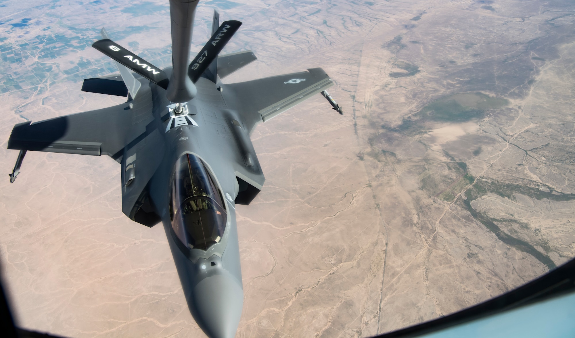 An Airman piloting an F-35A Lightning II completes aerial refueling courtesy of Airmen from the 28th Expeditionary Aerial Refueling Squadron aboard a KC-135R Stratotanker, April 26, 2019 over an undisclosed location. The F-35 is on its first deployment to the Middle East as part of the inaugural demonstration of the fighter's next generation combat capabilities. (U.S. Air Force photo by Senior Airman Keifer Bowes)