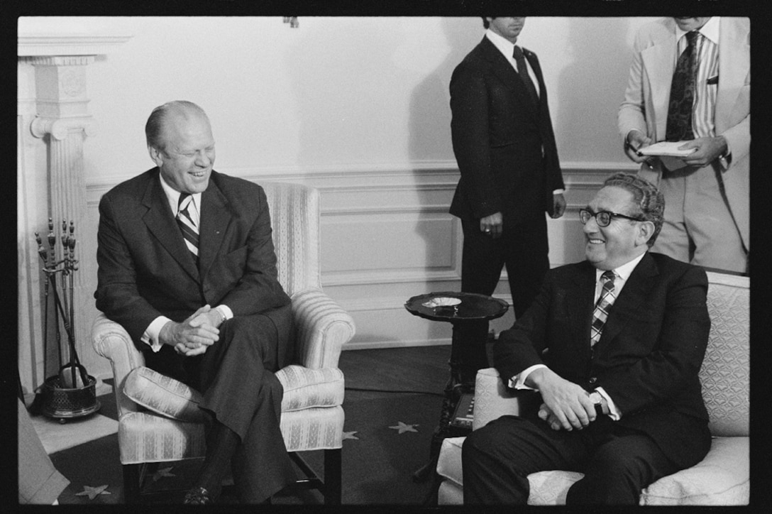 President Gerald Ford and Secretary of State Henry Kissinger seated in the Roosevelt Room of the White House