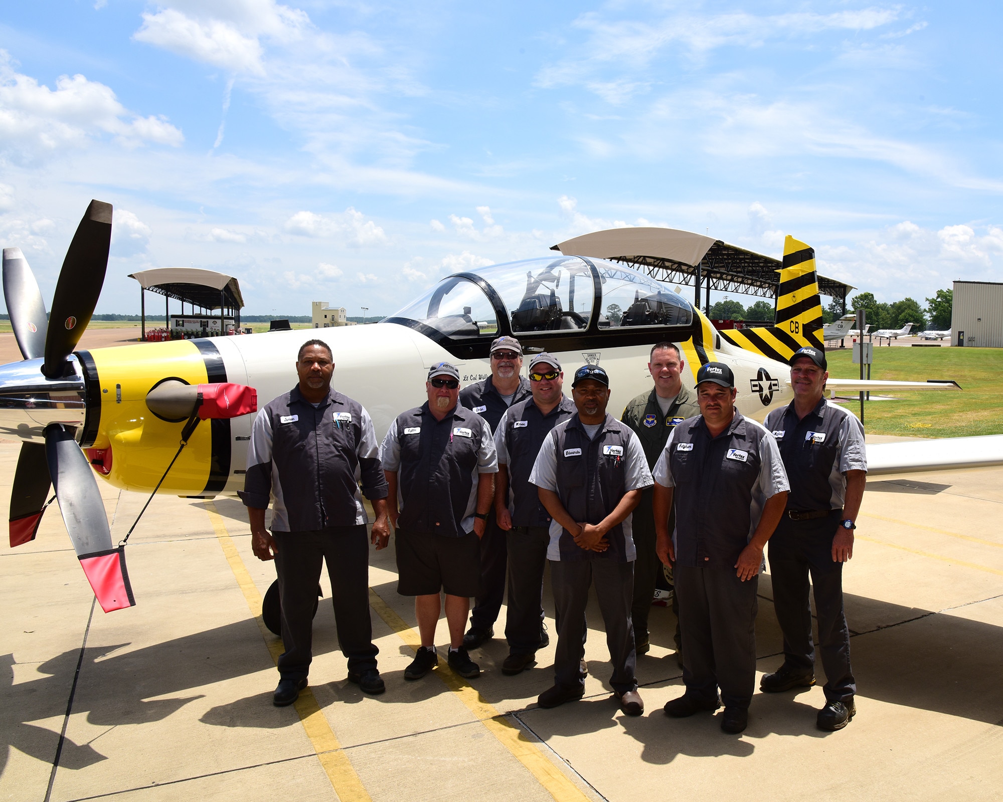 The 37th Flying Training Squadron’s new flagship T-6 Texan II is showcased alongside the maintainers who painted it May 30, 2019, on Columbus Air Force Base. Members of the 37th FTS took inspiration for their design from their history to celebrate their past, present and future. (U.S. Air Force photo by Elizabeth Owens)