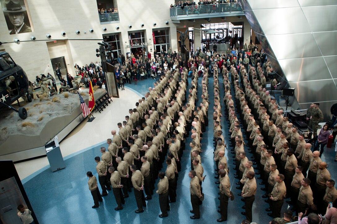 The Basic School (TBS) India Company Marines await the start of their swearing-in ceremony conducted at the National Museum of the Marine Corps, Triangle, Va., Feb. 6, 2014. The newly appointed Officer's will begin training at TBS in the month of February until May 2014. (U.S. Marine Corps photo by Cpl. Christina O'Neil/Released)