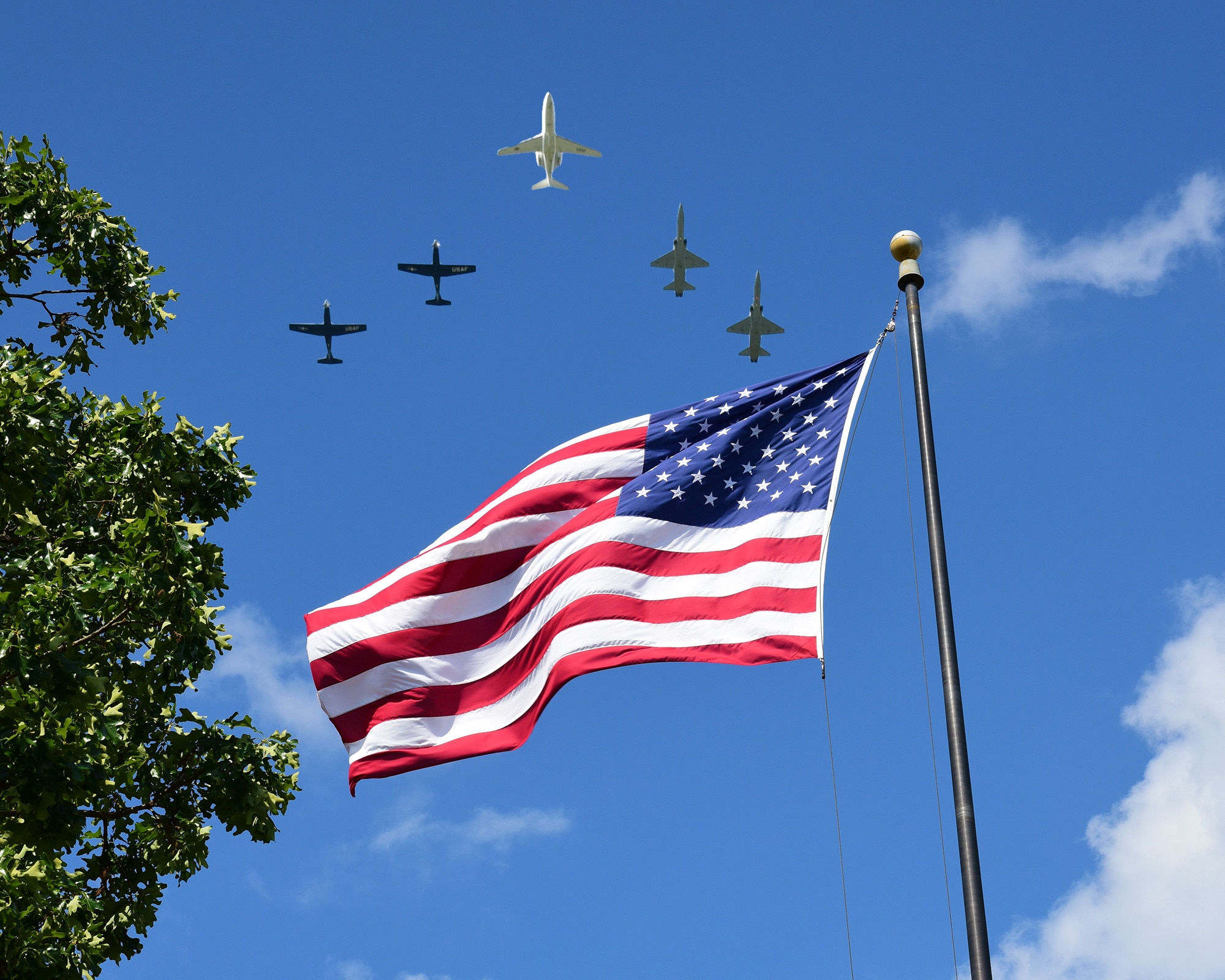 A five-ship formation performs a flyover during a Memorial Day ceremony practice run May 21, 2019, at the Richard “Gene” Smith Plaza on Columbus Air Force Base, Miss. The lead aircraft, a T-1A Jayhawk, was the same aircraft that 1st Lt. David Albandoz, Specialized Undergraduate Pilot Training Class 17-14 graduate, flew during his last flight as a student pilot in SUPT here. (U.S. Air Force photo by Melissa Doublin)