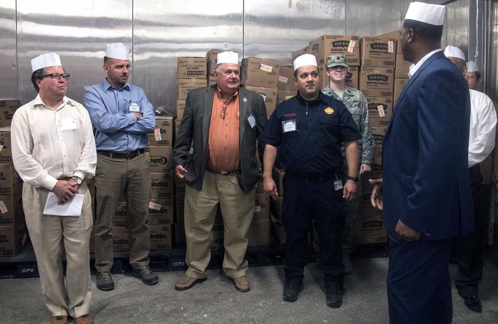 502nd Air Base Wing Honorary Commanders receive a tour of the Slagel dining facility at Joint Base San Antonio-Fort Sam Houston May 21 from Henry Parker, 802d Force Support Squadron Sustainment Services Flight Chief.