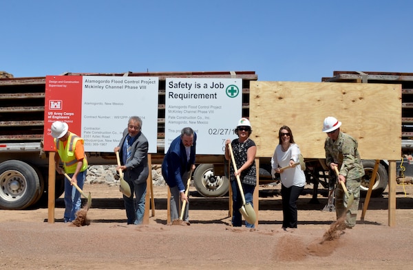 ALAMOGORDO, N.M. -- (l-r): Jeff Ridolpho, project manager, Pate Construction; Rene Romo, Sen. Udall’s office; Alamogordo Mayor Pro-Tem Jason Baldwin; Nancy Belshaler, project manager, City of Alamogordo; Dara Parker, Senator Heinrich’s office; and Lt. Col. Larry Caswell, Albuquerque District commander, officially break ground on the final phase of the Alamogordo McKinley Channel Flood Control Project, May 17, 2019.