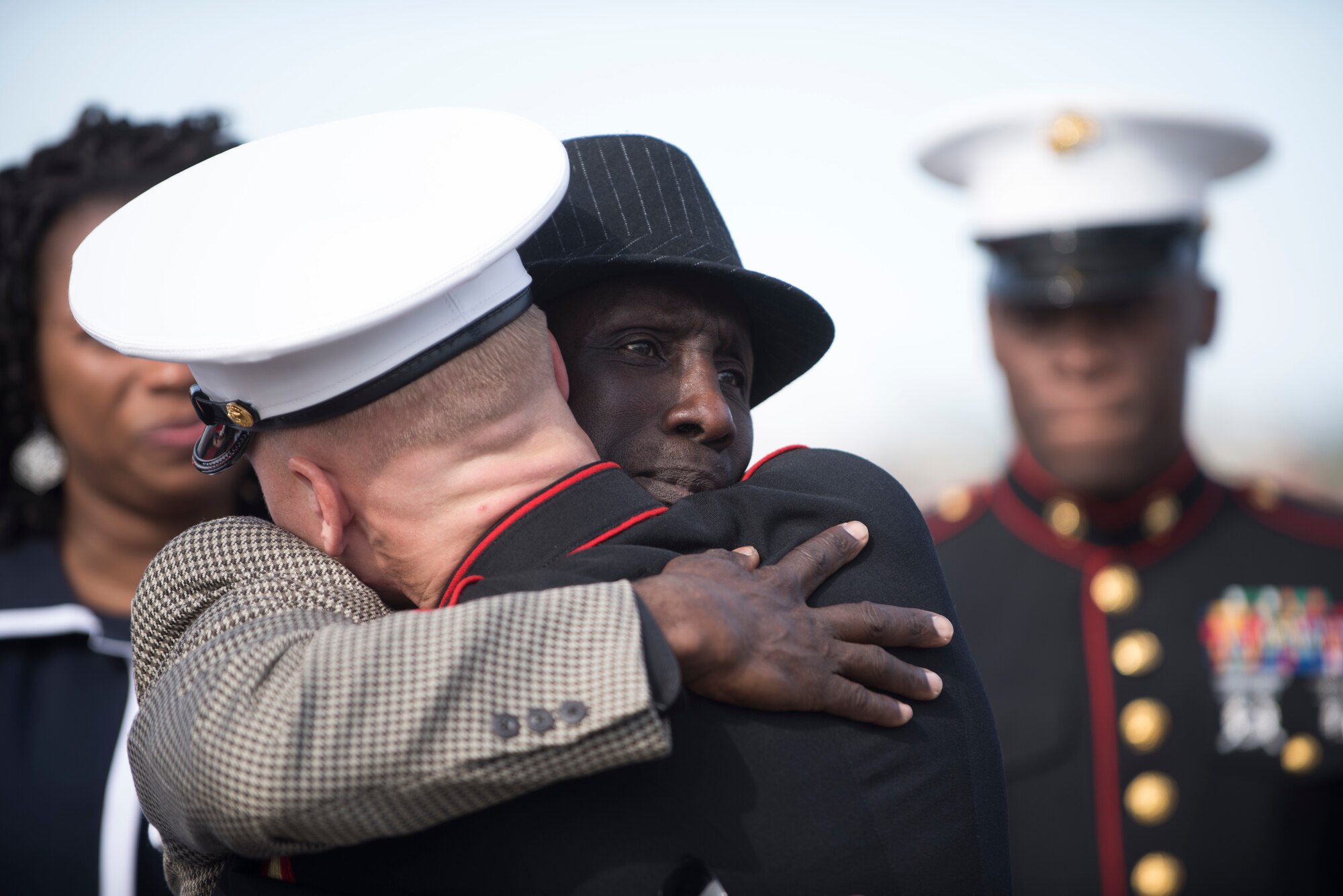 The father of a fallen Marine hugs Lance Cpl. Kyle Pierce, Alpha Company administrative specialist, Headquarters and support Battalion, Marine Corps Installations East, during a dignified transfer at the Phoenix Sky Harbor International Airport in Phoenix May 17, 2019.