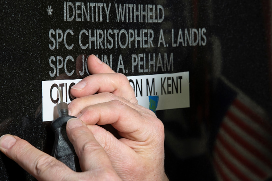 Photo of CTICS Kent's name being engraved on the National Cryptologic Memorial Wall