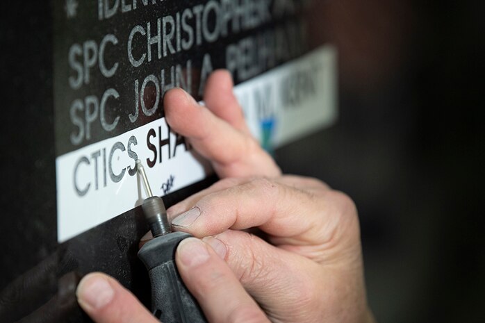 Photo of CTICS Kent's name being engraved on the National Cryptologic Memorial Wall