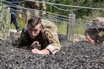 Senior Airman William McLaughlin, 502nd Security Forces Squadron combat arms instructor, competes in an obstacle course race during Police Week May 14, 2019, at Joint Base San Antonio, Texas. National Police Week dates back to 1962, when President John F. Kennedy proclaimed May 15 as National Peace Officers Memorial Day. That same year, Congress established by joint resolution the week in which May 15 falls as National Police Week.
