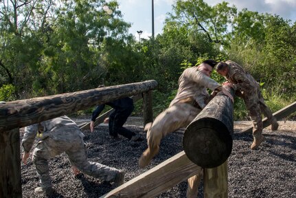 Joint Base San Antonio security forces members compete in an obstacle course race during Police Week May 14, 2019, at Joint Base San Antonio, Texas. National Police Week dates back to 1962, when President John F. Kennedy proclaimed May 15 as National Peace Officers Memorial Day. That same year, Congress established by joint resolution the week in which May 15 falls as National Police Week.