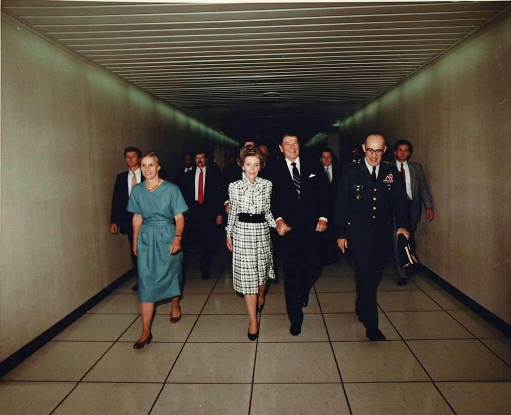 President and Mrs. Reagan tour the new OPS2A and 2B Buildings with LTG Odom and Mrs. Odom on 26 September 1986
