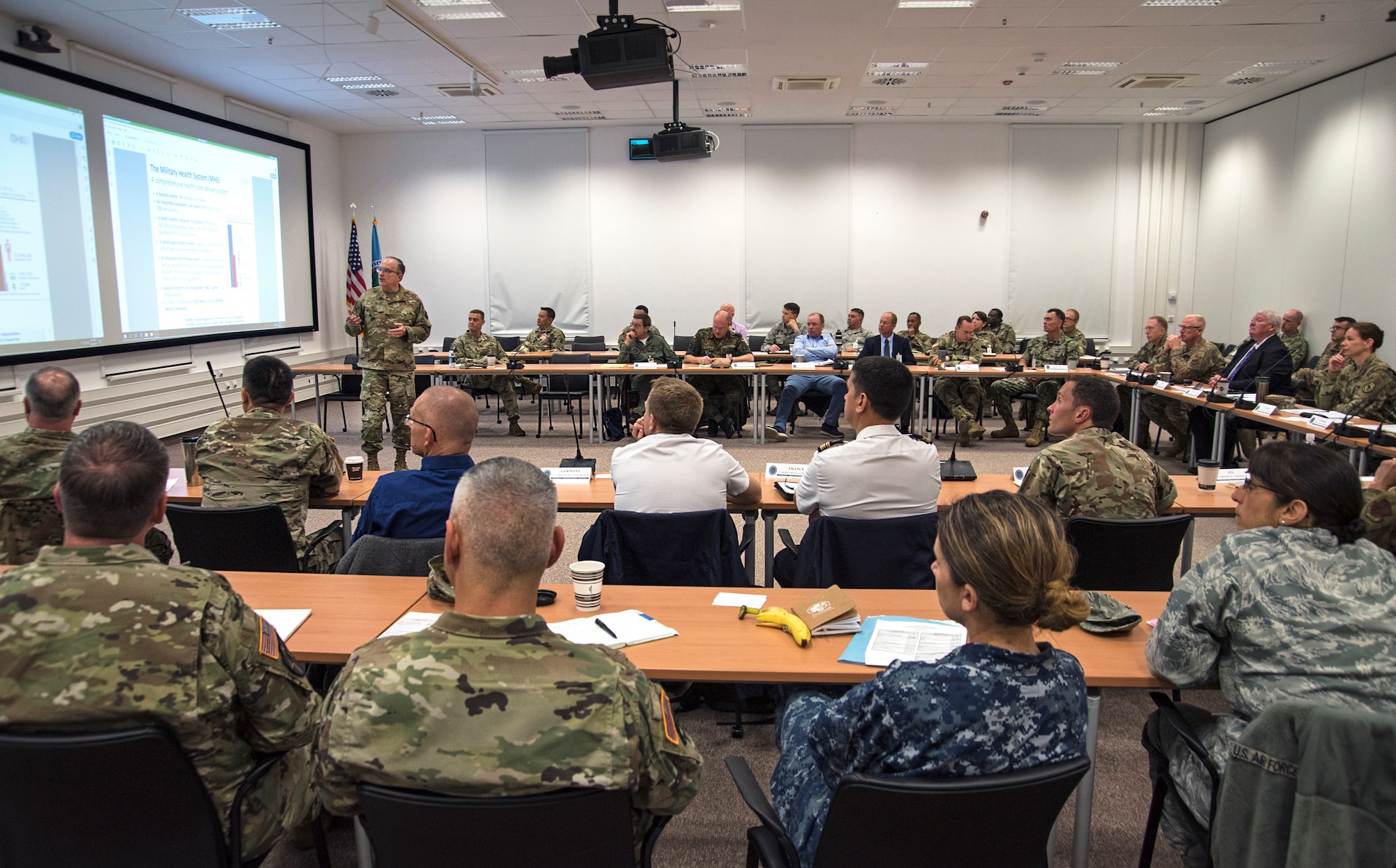 Attendees listen to a brief on the upcoming changes to the military health system during day one of the 2019 U.S. Africa Command Surgeon Synchronization Conference in Stuttgart, Germany, May 28, 2019. The conference brought together medical professionals from across the command, and interagency and foreign partners, to enable collaboration and to discuss areas of concern within the medical enterprise in Africa. (U.S. Navy photo by Mass Communication Specialist 1st Class Christopher Hurd)