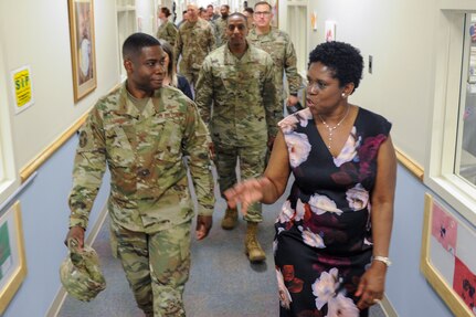 Vivian Gadson, 628th Force Support Squadron flight chief of fleet and family services, explains the expansions and renovations to the child development center to Col. Terrence Adams, 628th Air Base Wing commander, after a ribbon cutting ceremony May 31, 2019, at the Joint Base Charleston Air Base, S.C.