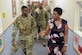 Vivian Gadson, 628th Force Support Squadron flight chief of fleet and family services, explains the expansions and renovations to the child development center to Col. Terrence Adams, 628th Air Base Wing commander, after a ribbon cutting ceremony May 31, 2019, at the Joint Base Charleston Air Base, S.C.