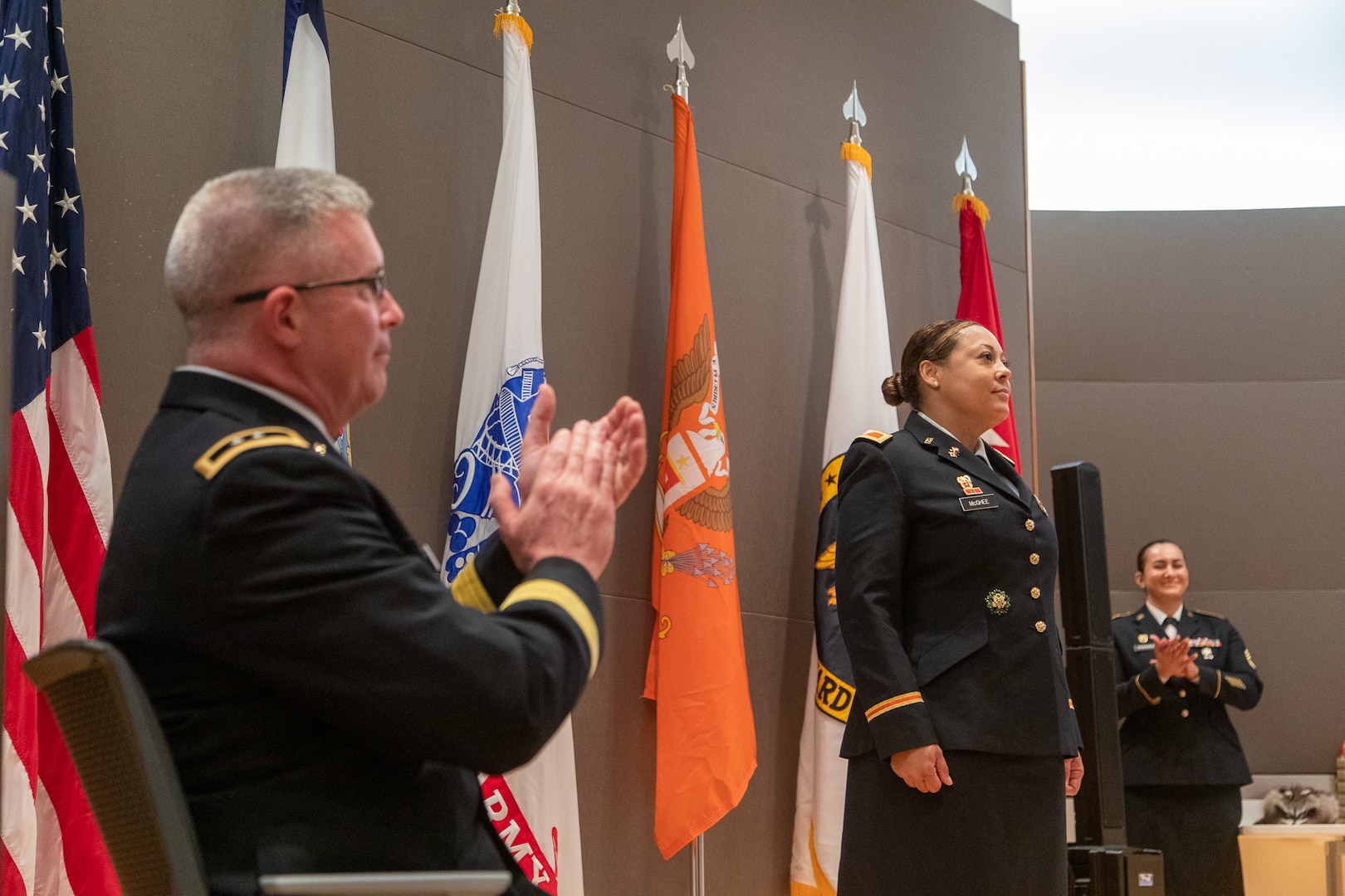 Col. Kim McGhee (center) is applauded by Maj. Gen. James Hoyer, Adjutant General of the West Virginia National Guard, during a formal promotion ceremony held May 20, 2019, at the Army National Guard Readiness Center in Arlington, Virginia. McGhee is the first African-American female to be promoted to the rank of colonel in the West Virginia Army National Guard. (Courtesy photo)