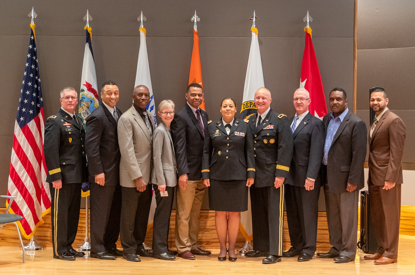 Col. Kim McGhee, center, poses for a photo with family, friends and colleagues following her promotion to O-6 May 20, 2019, at the Army National Guard Readiness Center in Arlington, Virginia. McGhee is the first African-American female to be promoted to the rank of colonel in the West Virginia Army National Guard. (Courtesy photo)