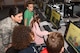 1st Lt. Jazmin Furtado, a U.S. Air Force engineer, observes STARBASE students Caiden Stickney, Allison Boe, Kayla Koala, and Scott Santos Jr., all 11 years old, from Peabody, Mass., public schools, during a presentation at Hanscom Air Force Base, Mass., May 30. Furtado demonstrated the communication equipment she helps design at Hanscom and talked about her role as an engineer and her training in the U.S. Air Force Academy. The students were attending STARBASE, a week-long Department of Defense elementary school program designed to educate students in the science, technology, engineering and math fields. (U.S. Air Force photo by Todd Maki)