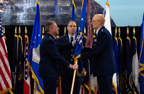 Air Force Chief of Staff Gen. David L. Goldfein passes the flag to Gen. Arnold W. Bunch, Jr. as Bunch assumes command of Air Force Materiel Command during a ceremony at the National Museum of the United States Air Force, Wright-Patterson Air Force Base, Ohio, May 31, 2019. Bunch takes command of Air Force Materiel Command after serving as the Deputy to the Assistant Secretary of the Air Force for Acquisition, Technology, and Logistics at the Pentagon. (U.S. Air Force photo/Scott M. Ash)
