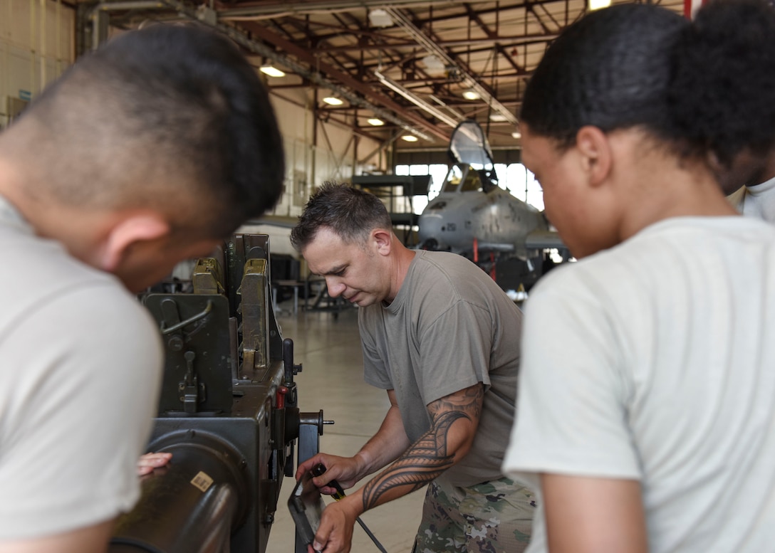 Tech. Sgt. Joshua Pa'akaula, 363rd Training Squadron special missions aircraft armament instructor, removes a panel from a Bofors 40 mm cannon at Sheppard Air Force Base, Texas, May 31, 2019. Learning about the components of a Bofors 40 mm cannon and how to repair it is one of my many skills maintenance Airmen acquire throughout their course. Airmen assigned to the Lockheed AC-130 aircraft will be familiar with its weapons systems upon course completion. (U.S. Air Force photo by Senior Airman Ilyana A. Escalona)