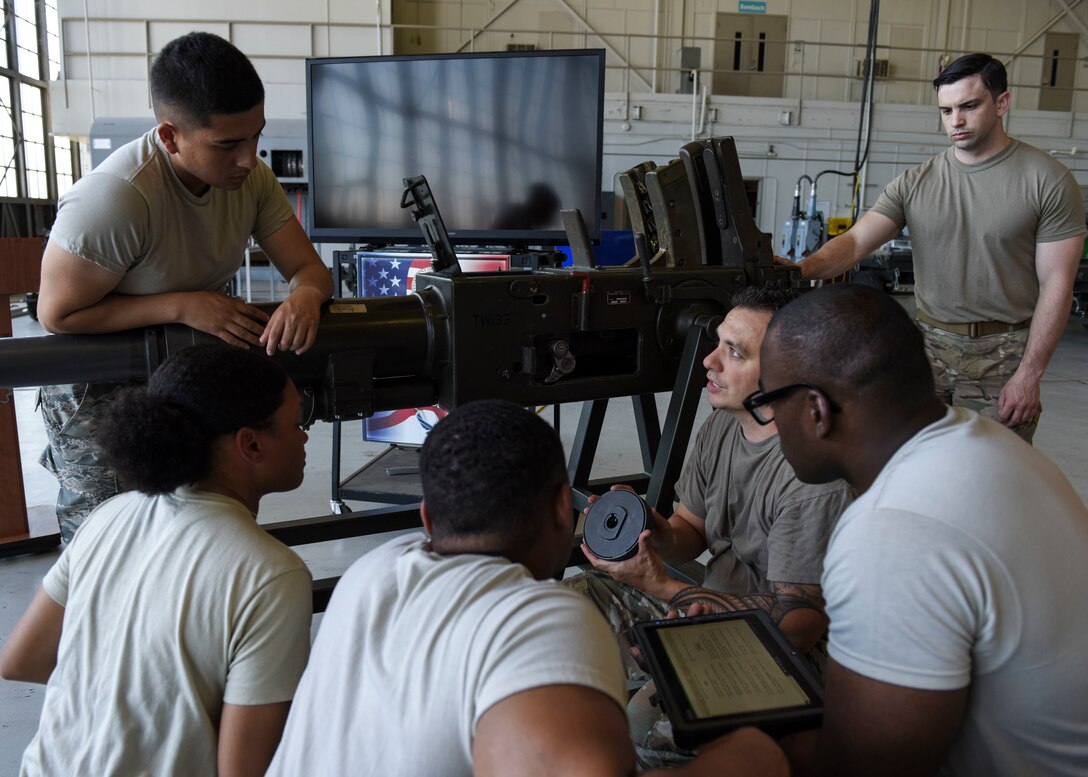 Tech. Sgt. Joshua Pa'akaula, 363rd Training Squadron special missions aircraft armament instructor, describes the components of a Bofors 40 mm cannon to students at Sheppard Air Force Base, Texas, May 31, 2019. Learning about the components of a Bofors 40 mm cannon and how to repair it is one of my many skills maintenance Airmen acquire throughout their course. Airmen assigned to the Lockheed AC-130 aircraft will be familiar with its weapons systems upon course completion. (U.S. Air Force photo by Senior Airman Ilyana A. Escalona)