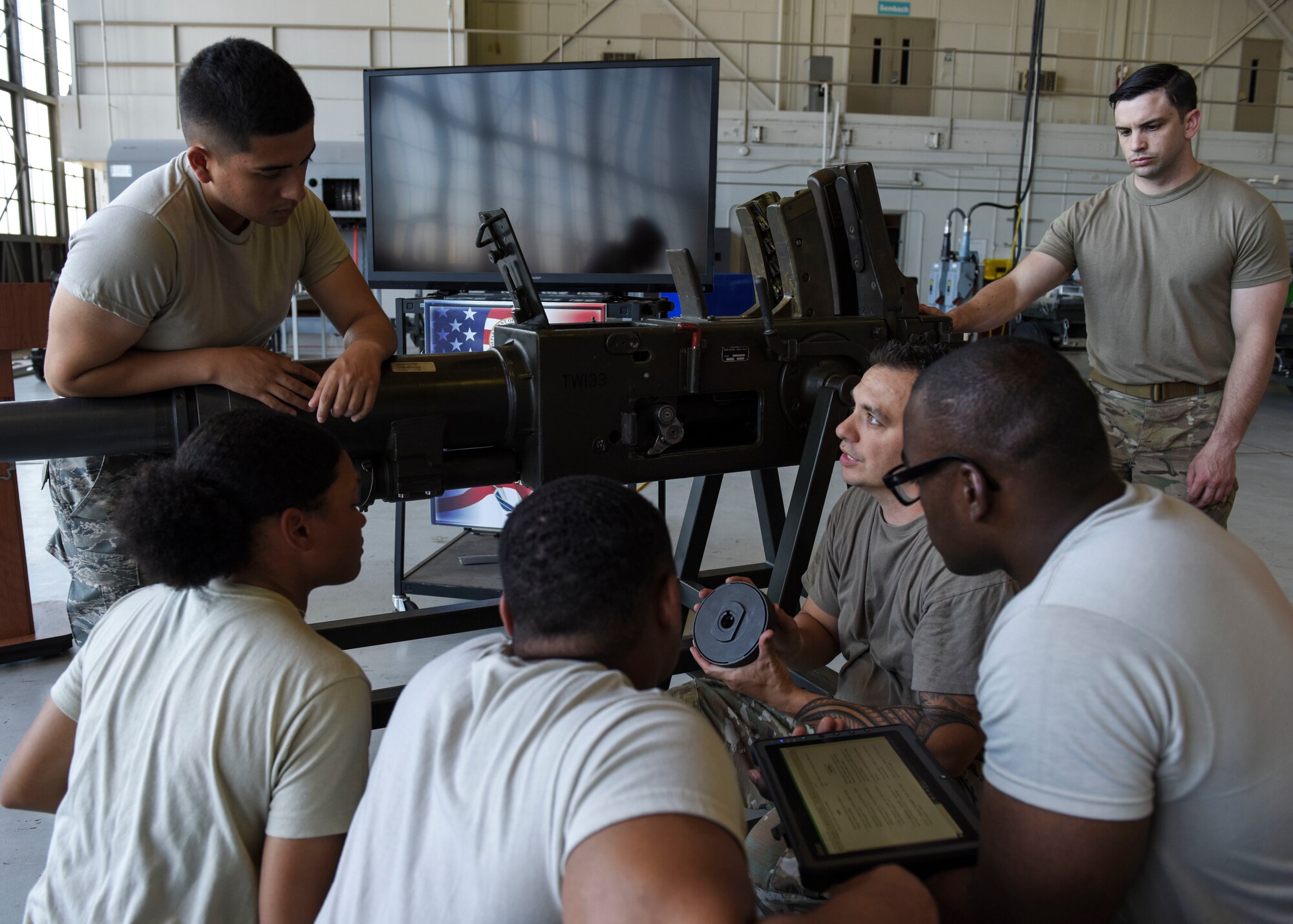 Tech. Sgt. Joshua Pa'akaula, 363rd Training Squadron special missions aircraft armament instructor, describes the components of a Bofors 40 mm cannon to students at Sheppard Air Force Base, Texas, May 31, 2019. Learning about the components of a Bofors 40 mm cannon and how to repair it is one of my many skills maintenance Airmen acquire throughout their course. Airmen assigned to the Lockheed AC-130 aircraft will be familiar with its weapons systems upon course completion. (U.S. Air Force photo by Senior Airman Ilyana A. Escalona)