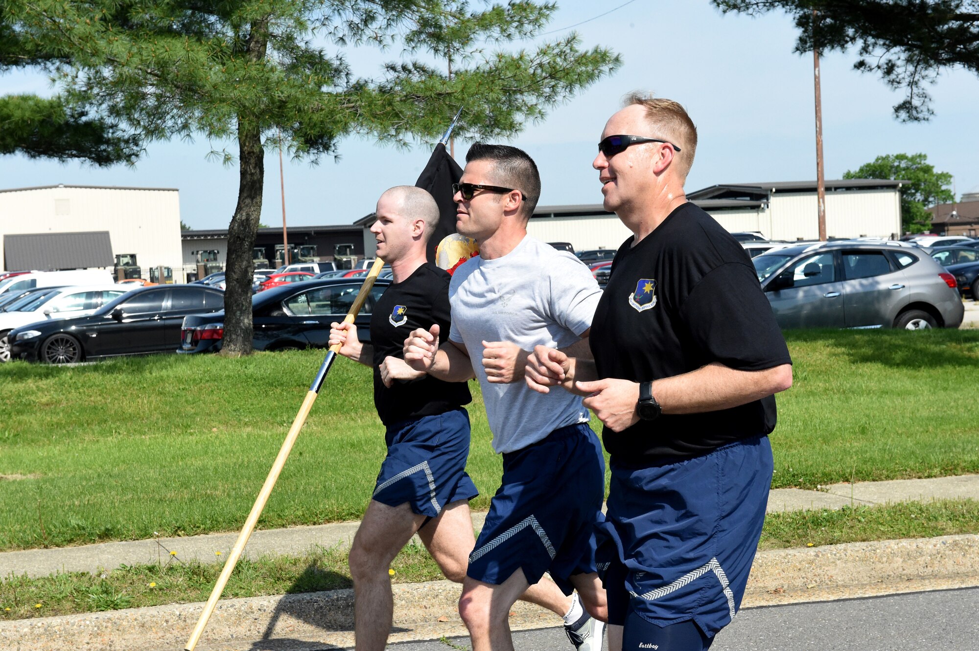 Airmen run in formation during the 5th Annual Port Dawg Memorial 5K Run at at Joint Base McGuire-Dix-Lakehurst, N.J. May 17, 2019. The Port Dawg Memorial Run honors aerial porters who lost their lives the previous year. (U.S. Air Force photo by Staff Sgt. Sarah Brice)