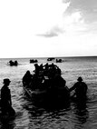 Company A, Battalion Landing Team 1/4, 31st Marine Expeditionary Unit, conducts an amphibious landing by small boat at DadiBeach, Naval Base Guam, the same landing area that 1st Battalion, 4th Marines landing at during the liberation of Guam in World War II. Company A was tasked with being the Small Boat Raid Company of the 31st MEU during their deployment, and sent Marines to several weeks of rigorous instruction at Expeditionary Warfare Training Group –Pacific, in Coronado, California, to learn the skills needed to carry out this mission. Marines from Company A became highly skilled Small Boat Coxswains, Small Boat and Engine Mechanics, Scout Swimmers and Maritime Navigators, helping the Company become a successful clandestine small boat raid force during deployment.