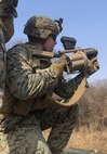Lance Corporal Rosenberryof 2nd Platoon, Company C, 1st Battalion, 4th Marines fires the M32 Grenade Launcher during Dragon Viper 19.1 at Story Live Fire Complex in South Korea, February 21 2019.