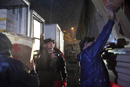 U.S. Army Staff Sgt. Gary Chavis of the North Carolina National Guard monitors the loading of cots and blankets onto a Light Medium Tactical Vehicle (LMTV), which were transported to various American Red Cross shelters in the aftermath of Hurricane Florence in Fayetteville, Sept. 16, 2018.