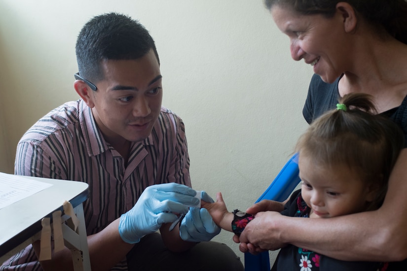 U.S. Army Spc. Alec Pagtakhan, Joint Task Force – Bravo Medical Element EMT medic, gathers a blood sample to check the child’s hemoglobin levels during a Pediatric Medical Readiness Training Exercise May 23, 2019 in La Paz, Honduras. MEDRET missions allow JTF-B medical personnel to train in their areas of expertise, while providing a service and strengthening partnership with the host nation. The service members saw approximately 120 patients during the mission. (U.S. Air Force photo by Staff Sgt. Eric Summers Jr.)