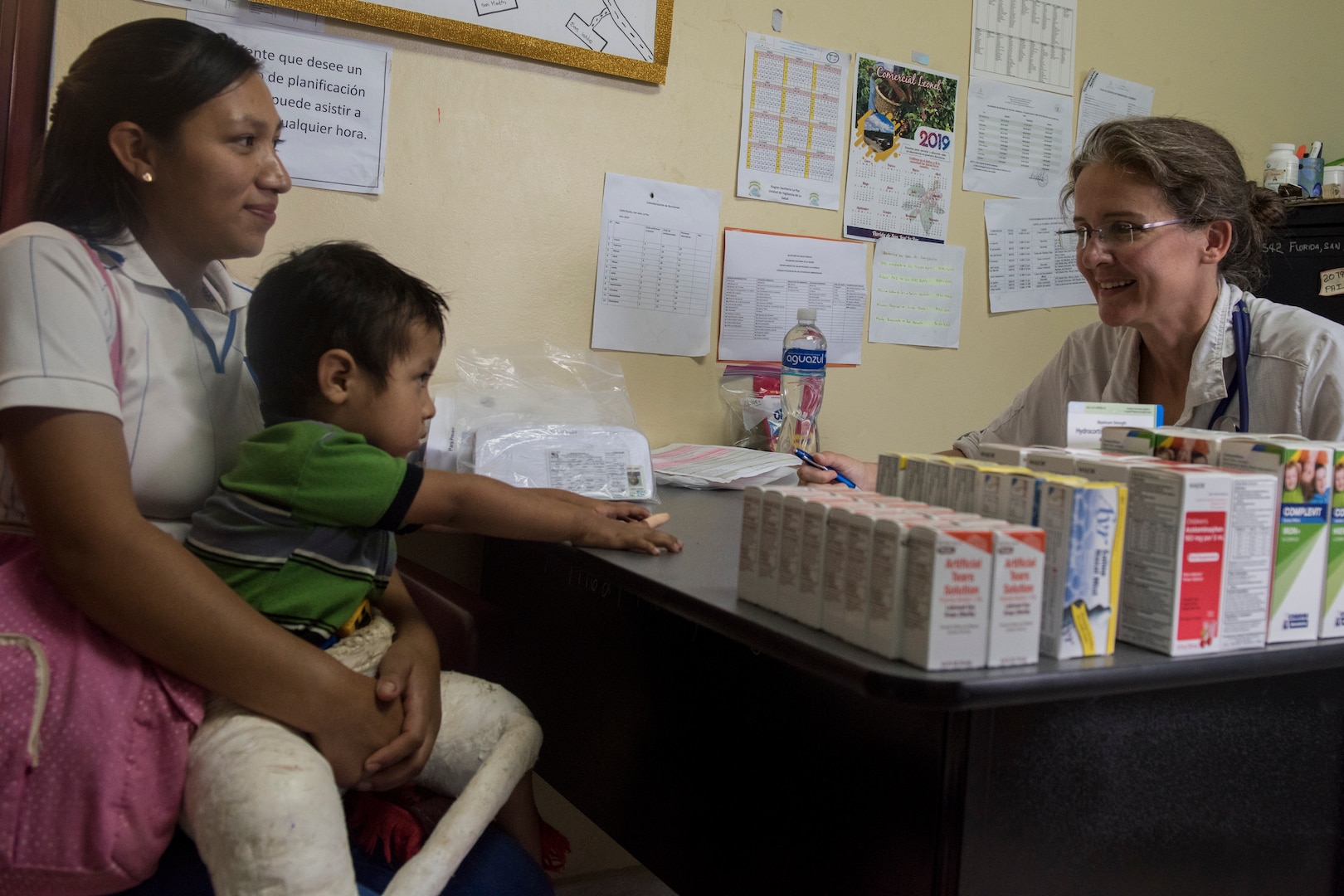 U.S. Army Lt. Col. Anne Johnson, Joint Task Force – Bravo Medical Element physician, reviews a child’s symptoms with his mother during a Pediatric Medical Readiness Training Exercise May 23, 2019 in La Paz, Honduras. MEDRET missions allow JTF-B medical personnel to train in their areas of expertise, while providing a service and strengthening partnership with the host nation. The service members saw approximately 120 patients during the mission. (U.S. Air Force photo by Staff Sgt. Eric Summers Jr.)