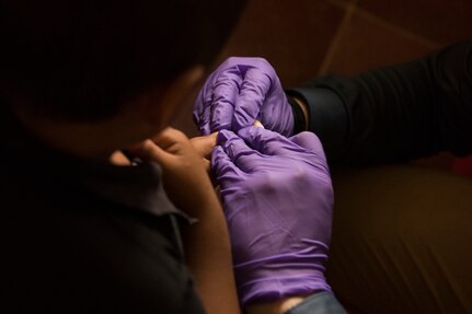 A medic from Joint Task Force – Bravo Medical Element takes a blood sample from a Honduran child during a Pediatric Medical Readiness Training Exercise May 23, 2019 in La Paz, Honduras. MEDRET missions allow JTF-B medical personnel to train in their areas of expertise, while providing a service and strengthening partnership with the host nation. The service members saw approximately 120 patients during the mission. (U.S. Air Force photo by Staff Sgt. Eric Summers Jr.)