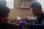 U.S. Army Spc. Colin Yap, Joint Task Force – Bravo Medical Element medic, pricks the finger of young girl to measure her hemoglobin levels during a Pediatric Medical Readiness Training Exercise May 23, 2019 in La Paz, Honduras. MEDRET missions allow JTF-B medical personnel to train in their areas of expertise, while providing a service and strengthening partnership with the host nation. The service members saw approximately 120 patients during the mission. (U.S. Air Force photo by Staff Sgt. Eric Summers Jr.)