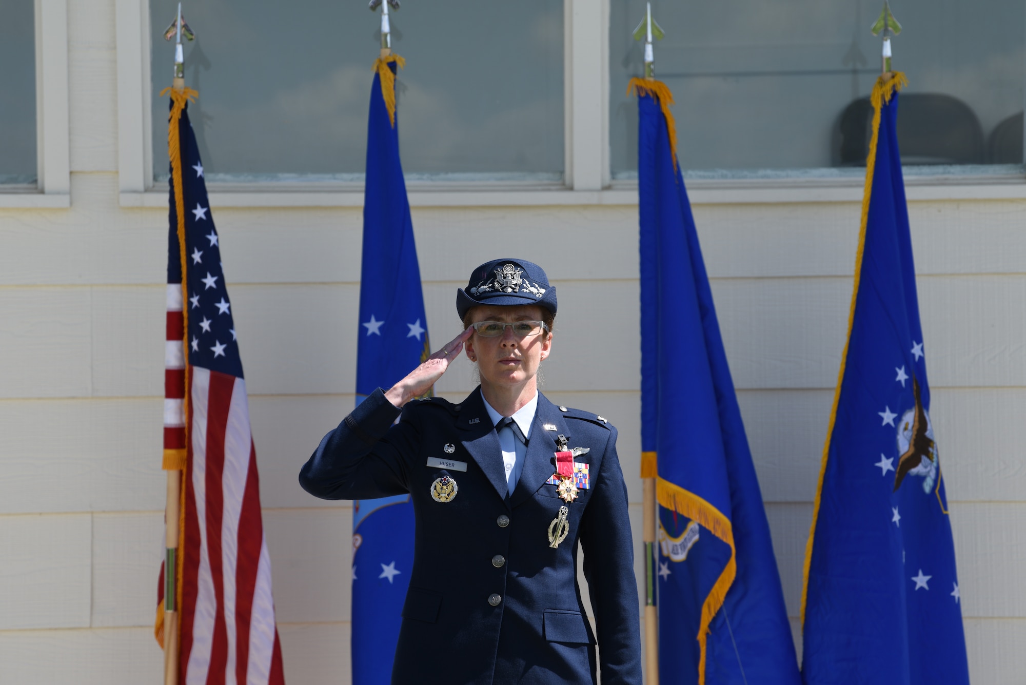 Colonel Stacy Jo Huser gives her last salute as 90th Missile Wing commander during the change of command ceremony on the Argonne Parade Field at F.E. Warren Air Force Base, Wyo., May 31, 2019. Huser will be heading to Offutt Air Force Base, Neb.,  as the director of the commander’s action group.  (U.S. Air Force photo by Staff Sgt. Ashley N. Sokolov)