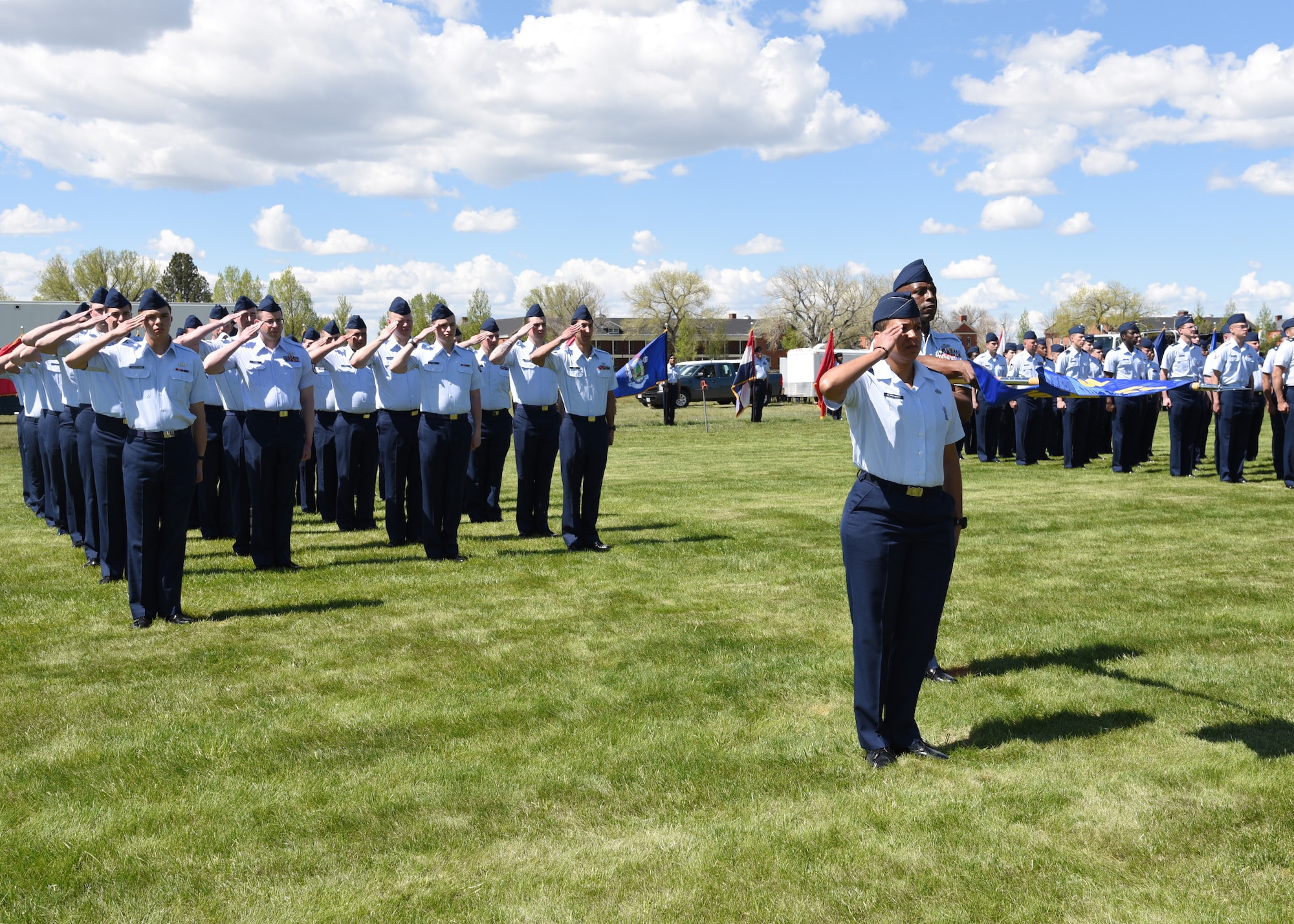 Major Christine Hernandez, 790th Maintenance Squadron Commander, Master Sgt. Eric Adams, First Sergeant for the 790th MXS and the 90th Munitions Squadron, and 790th MXS Airmen, render a final salute to Col. Stacy Huser, outgoing commander of the 90th Missile Wing during the 90th Missile Wing change of command ceremony May 31, 2019, on the Argonne Parade Field at F. E. Warren Air Force Base, Wyo. The ceremony signified the transition of command from Col. Stacy Huser to Col. Peter Bonetti.