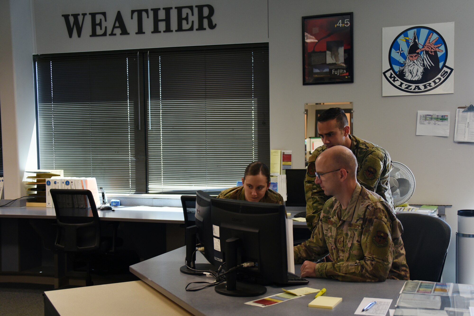 Capt. Gretchen De Blaey, 2nd Lt Kevin Smith and Master Sgt. Mark Bryson, 80th Operations Support Squadron Weather Flight