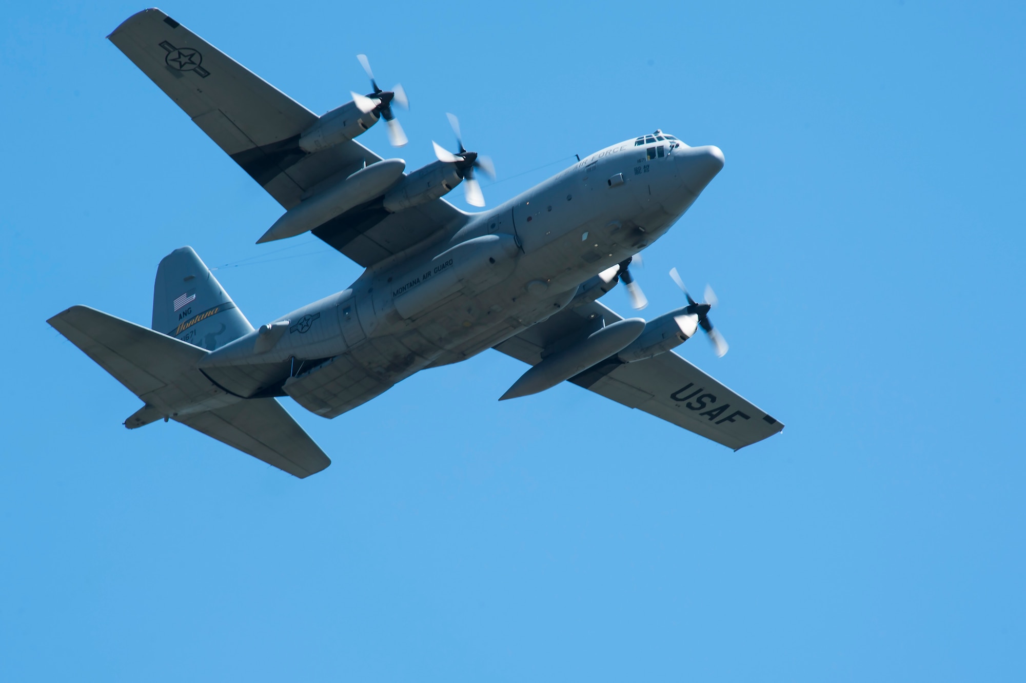 A C-130 Hercules transport aircraft from the Montana Air National Guard 120th Airlift Wing flies over the flight line May 29, 2019, at Malmstrom Air Force Base, Mont.