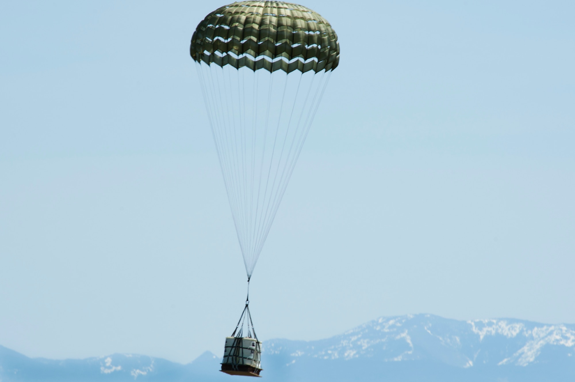 A Container Delivery System bundle lands on the drop zone known as Charging Charlie May 29, 2019, at Malmstrom Air Force Base, Mont.